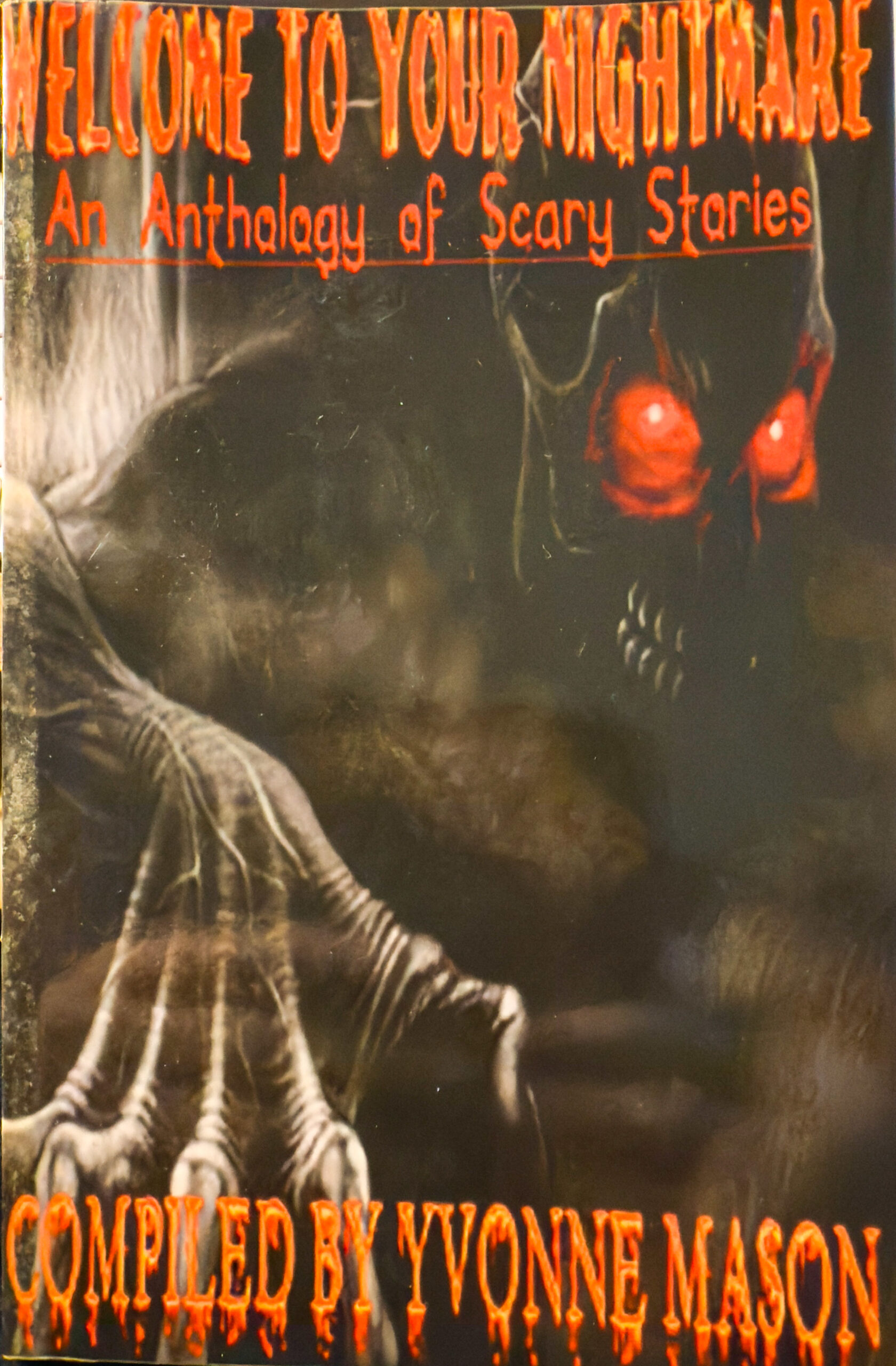 Cover of Welcome to Your Nightmare: An Anthology of Scary Stories compiled by Yvonne Mason. A skeletal figure with glowing red eyes reaches forward from the shadows.