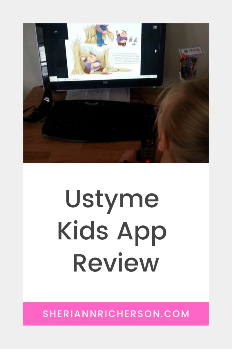My grand daughter sitting at a computer while I read Three Little Pigs using the Ustyme Kids App.