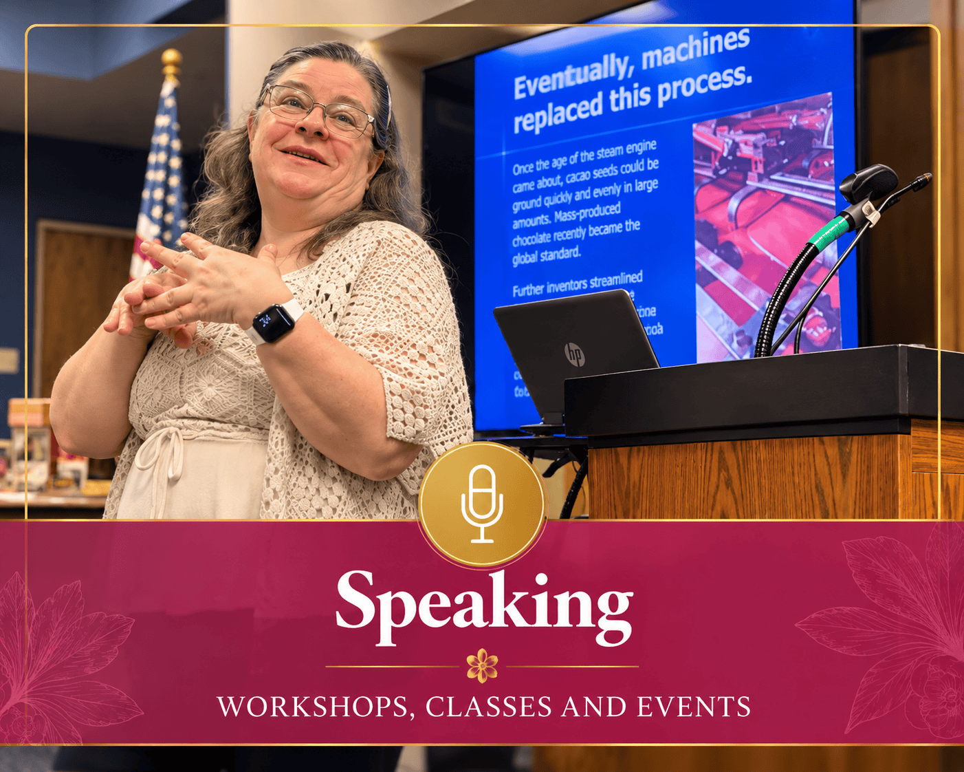 Sheri Ann Richerson speaking at an event with a microphone, laptop and presentation screen.